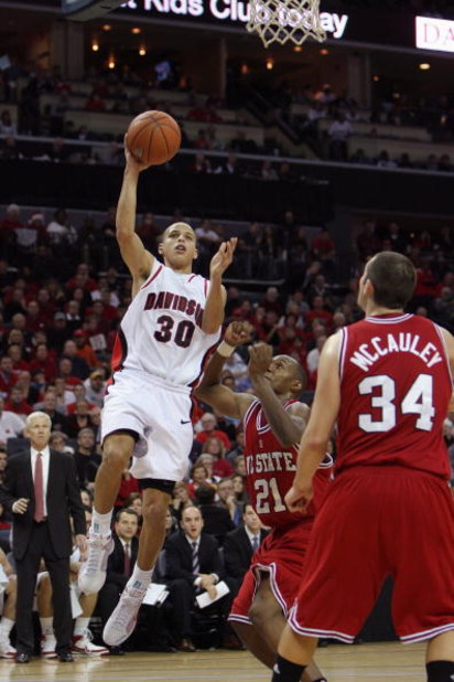 CHARLOTTE, NC - DECEMBER 6:  Stephen Curry #30 of the Davidson Wildcats goes up with the ball during the game against the North Carolina State Wolfpack at Time Warner Cable Arena on December 6, 2008 in Charlotte, North Carolina. (Photo by Streeter Lecka/G
