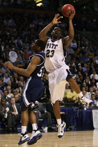 BOSTON - MARCH 26:  Sam Young #23 of the Pittsburgh Panthers drives to the hoop against Terell Holloway #52 of the Xavier Musketeers during the NCAA Men's Basketball Tournament East Regionals at TD Banknorth Garden on March 26, 2009 in Boston, Massachuset