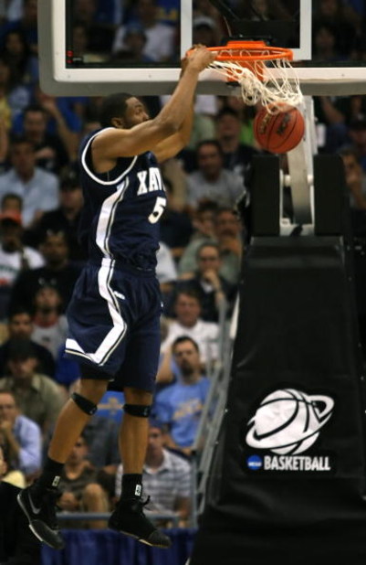 PHOENIX - MARCH 29:  Derrick Brown #5 of the Xavier Musketeers dunks the ball against the UCLA Bruins during the first half of the West Regional Final at the U.S. Airways Center on March 29, 2008 in Phoenix, Arizona.  (Photo by Stephen Dunn/Getty Images)