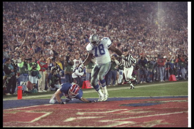 31 Jan 1993: Wide receiver Don Beebe of the Buffalo Bills (left) forces a fumble on defensive tackle Leon Lett of the Dallas Cowboys during Super Bowl XXVII at the Rose Bowl in Pasadena, California. The Cowboys won the game, 52-17.