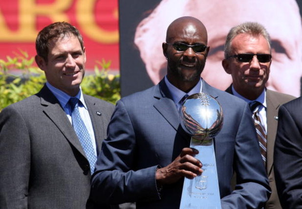 SAN FRANCISCO - AUGUST 10:  (L-R) Former San Francisco 49er players Steve Young, Jerry Rice and Joe Montana stand with a Super Bowl trophy during a public memorial service for former 49ers coach Bill Walsh August 10, 2007 at Monster Park in San Francisco,