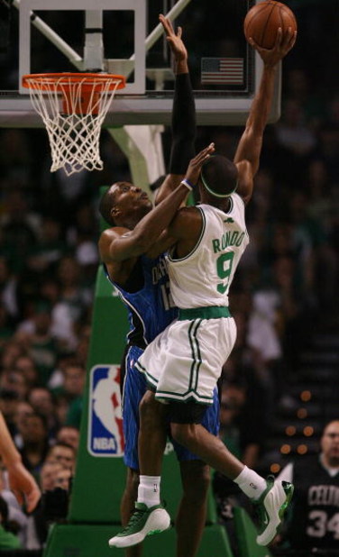 BOSTON - MAY 04:  Dwight Howard #12 of the Orlando Magic fouls Rajon Rondo #9 of the Boston Celtics in Game One of the Eastern Conference Semifinals during the 2009 NBA Playoffs at TD Banknorth Garden on May 4, 2009 in Boston, Massachusetts. The Magic def