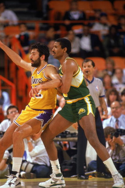 LOS ANGELES - 1990:  Steve Johnson #33 of the Seattle Supersonics and Vlade Divac #12 of the Los Angeles Lakers battle for position during a game in the 1989-1990 NBA season at the Great Western Forum in Los Angeles, California.  (Photo by Ken Levine/Gett