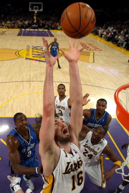 LOS ANGELES, CA - JUNE 07:  Pau Gasol #16 of the Los Angeles Lakers goes up for a rebound in front of Dwight Howard #12 of the Orlando Magic in Game Two of the 2009 NBA Finals at Staples Center on June 7, 2009 in Los Angeles, California. NOTE TO USER: Use