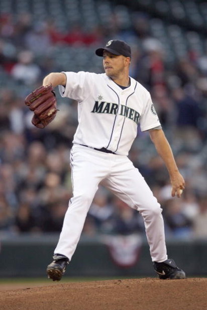 SEATTLE - APRIL 15:  Jarrod Washburn #56 of the Seattle Mariners delivers the pitch during the game against the Los Angeles Angels of Anaheim on April 15, 2009 at Safeco Field in Seattle, Washington. All Major League Baseball players are wearing #42 in ho