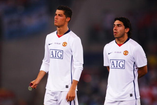 ROME - MAY 27:  Carlos Tevez of Manchester United and Cristiano Ronaldo of Manchester United look dejected after Barcelona won the UEFA Champions League Final match between Barcelona and Manchester United at the Stadio Olimpico on May 27, 2009 in Rome, It