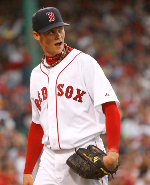 BOSTON - JULY 29: Clay Buchholz #61 of the Boston Red Sox reacts after a rough inning against the Los Angeles Angels of Anaheim at Fenway Park on July 29, 2008 in Boston, Massachusetts.  (Photo by Jim Rogash/Getty Images)