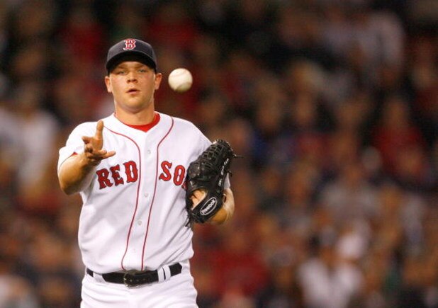 BOSTON - APRIL 26: Michael Bowden #64 of the Boston Red Sox throws to first against the New York Yankees at Fenway Park on April 26, 2009 in Boston, Massachusetts. (Photo by Jim Rogash/Getty Images)
