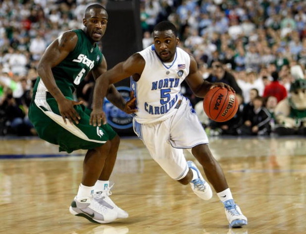 DETROIT - APRIL 06:  Ty Lawson #5 of the North Carolina Tar Heels drives on Travis Walton #5 of the Michigan State Spartans in the second half during the 2009 NCAA Division I Men's Basketball National Championship game at Ford Field on April 6, 2009 in De