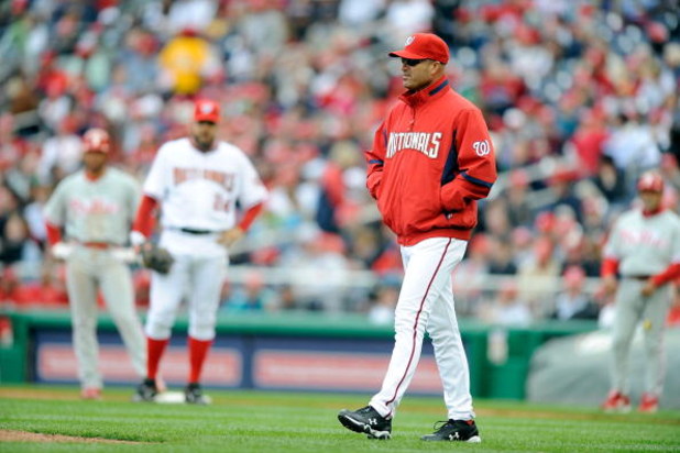 WASHINGTON - APRIL 13:  Manager Manny Acta of the Washington Nationals walks out to the pitchers mound during the game against the Philadelphia Phillies at Nationals Park on April 13, 2009 in Washington, DC.  (Photo by Greg Fiume/Getty Images)