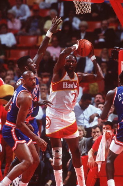 1990: Center Moses Malone of the Atlanta Hawks controls the basketball during the Hawks versus New York Knicks game. Mandatory Credit: Allsport USA/ALLSPORT