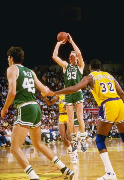 19 Feb 1988:  Guard Larry Bird of the Boston Celtics shoots the ball as Magic Johnson of the Los Angeles Lakers shoots the ball during a game at the Great Western Forum in Inglewood, California.   Mandatory Credit: Rick Stewart  /Allsport