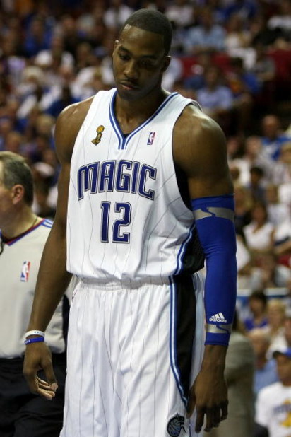 ORLANDO, FL - JUNE 14:  Dwight Howard #12 of the Orlando Magic looks down in the fourth quarter as the Magic trail the Los Angeles Lakers in Game Five of the 2009 NBA Finals on June 14, 2009 at Amway Arena in Orlando, Florida.  NOTE TO USER:  User express