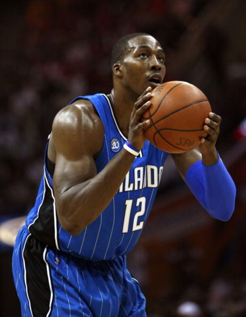 CLEVELAND - MAY 22:  Dwight Howard #12 of the Orlando Magic prepares to shoot a free throw against the Cleveland Cavaliers in Game Two of the Eastern Conference Finals during the 2009 Playoffs at Quicken Loans Arena on May 22, 2009 in Cleveland, Ohio. NOT