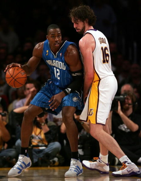 LOS ANGELES, CA - JUNE 07:  Dwight Howard #12 of the Orlando Magic posts up Pau Gasol #16 of the Los Angeles Lakers in the second half of Game Two of the 2009 NBA Finals at Staples Center on June 7, 2009 in Los Angeles, California. NOTE TO USER: User expr