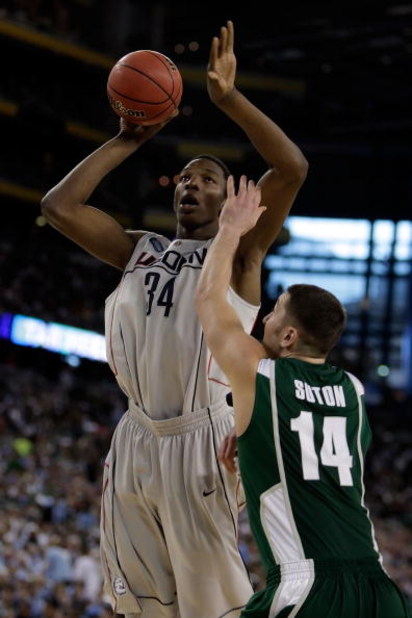 DETROIT - APRIL 04: Hasheem Thabeet #34 of the Connecticut Huskies goes up for a shot over Goran Suton #14 of the Michigan State Spartans in the first half during the National Semifinal game of the NCAA Division I Men's Basketball Championship at Ford Fi