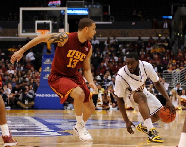 LOS ANGELES, CA - MARCH 14: Guard James Harden #13 of the Arizona State Sun Devils drives against guard Daniel Hackett #13 of the USC Trojans in the Pacific Life Pac-10 Men's Basketball Tournament Championship Game at the Staples Center on March 14, 2009