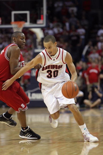CHARLOTTE, NC - DECEMBER 6:  Stephen Curry #30 of the Davidson Wildcats drives during the game against the North Carolina State Wolfpack at Time Warner Cable Arena on December 6, 2008 in Charlotte, North Carolina. (Photo by Streeter Lecka/Getty Images)