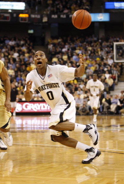 WINSTON-SALEM, NC - FEBRUARY 18:  Jeff Teague #0 of the Wake Forest Demon Deacons looks to control the loose ball during their game against the Georgia Tech Yellow Jackets at Lawrence Joel Coliseum on February 18, 2009 in Winston-Salem, North Carolina. Th