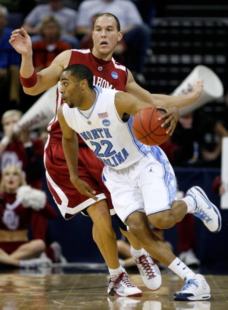 MEMPHIS, TN - MARCH 29: Wayne Ellington #22 of the North Carolina Tar Heels moves the ball as he is covered by Taylor Griffin #32 of the Oklahoma Sooners during the NCAA Men's Basketball Tournament South Regional Final at the FedExForum on March 29, 2009