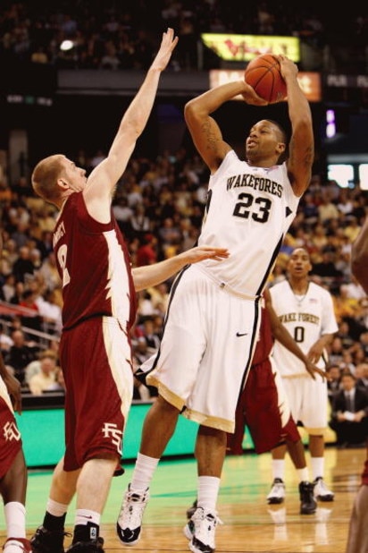 WINSTON-SALEM, NC - FEBRUARY 14: James Johnson #23 of the Wake Forest Demon Deacons shoots against Jordan DeMercy #2 of the Florida State Seminoles during the game at Lawrence Joel Coliseum on February 14, 2009 in Winston-Salem, North Carolina. (Photo by