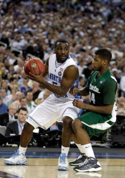 DETROIT - APRIL 06: Ty Lawson #5 of the North Carolina Tar Heels looks to drive on Korie Lucious #34 of the Michigan State Spartans during the 2009 NCAA Division I Men's Basketball National Championship game at Ford Field on April 6, 2009 in Detroit, Mi