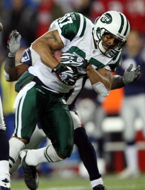 FOXBORO, MA - NOVEMBER 13:  Laveranues Coles #87 of the New York Jets is pulled down by James Sanders #36 of the New England Patriots on November 13, 2008 at Gillette Stadium in Foxboro, Massachusetts. The Jets defeated the Patriots 34-31 in overtime.  (P