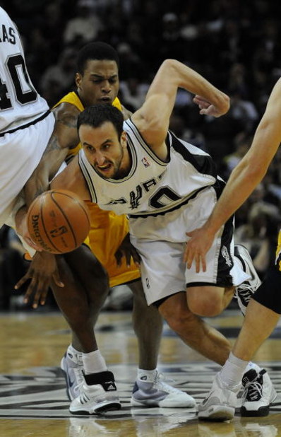 SAN ANTONIO - JANUARY 20:  Guard Manu Ginobili #20 of the San Antonio Spurs dribbles the ball past Brandon Rush #25 of the Indiana Pacers on January 20, 2009 at AT&T Center in San Antonio, Texas.  NOTE TO USER: User expressly acknowledges and agrees that,