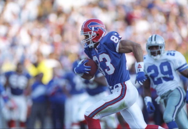 31 Jan 1993:  Wide receiver Andre Reed (left) of the Buffalo Bills runs with the ball during the Super Bowl  XXVII game against the Dallas Cowboys at the Rose Bowl in Pasadena, California. The Cowboys won the game 52-17. Mandatory Credit: Rick Stewart  /A