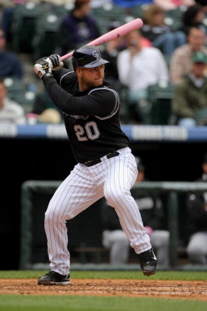 DENVER - MAY 10: Chris Iannetta #20 of the Colorado Rockies takes an at bat against the Florida Marlins during MLB action at Coors Field on May 10, 2009 in Denver, Colorado. Iannetta was one of many players using pink bats in Major League Baseball today