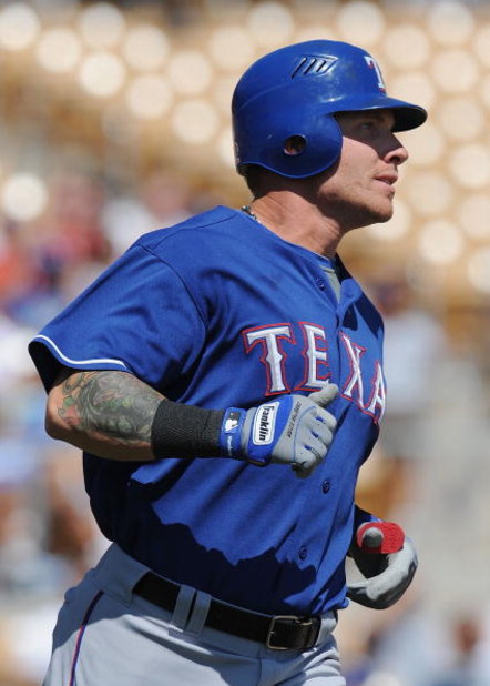 GLENDALE, AZ - MARCH 13:   Josh Hamilton #32 of the Texas Rangers runs the bases after hitting a homerun in the first inning during a Spring Training game against the Los Angeles Dodgers on March 13, 2009 at Camelback Ranch in Glendale, Arizona.  (Photo b