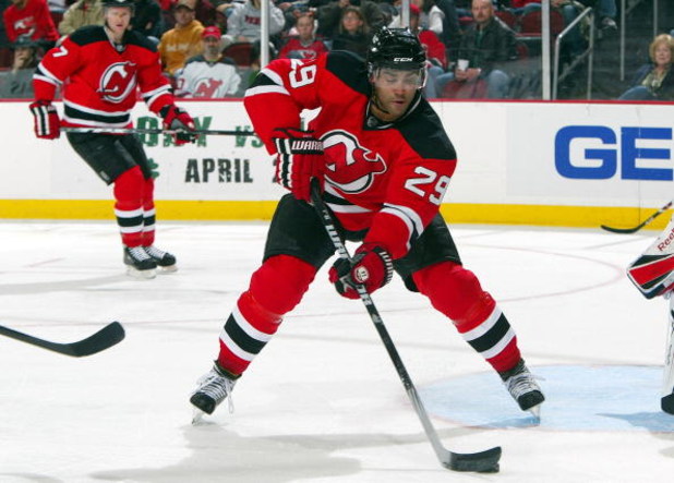 NEWARK, NJ - APRIL 11:  Johnny Oduya #29 of the New Jersey Devils skates against the Carolina Hurricanes at the Prudential Center on April 11, 2009 in Newark, New Jersey. The Devils defeated the Hurricanes 3-2.  (Photo by Jim McIsaac/Getty Images)