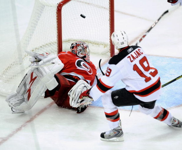 RALEIGH, NC - APRIL 19:  Travis Zajac #19 of the New Jersey Devils celebrates after scoring the game-wining goal in overtime against the Carolina Hurricanes during Game Three of the Eastern Conference Quarterfinals of the 2009 Stanley Cup Playoffs on Apri