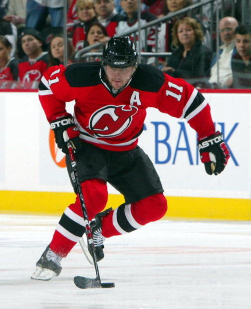 NEWARK, NJ - APRIL 23:  John Madden #11 of the New Jersey Devils skates against the Carolina Hurricanes during Game Five of the Eastern Conference Quarterfinal Round of the 2009 NHL Stanley Cup Playoffs on April 23, 2009 at the Prudential Center in Newark