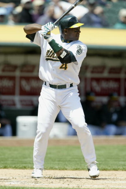OAKLAND, CA - MAY 8:  Miguel Tejada #4 of the Oakland Athletics at bat against the Chicago White Sox during the game at the Network Associates Coliseum on May 8, 2003 in Oakland, California.  The Athletics defeated the White Sox 8-5. (Photo by Jed Jacobso