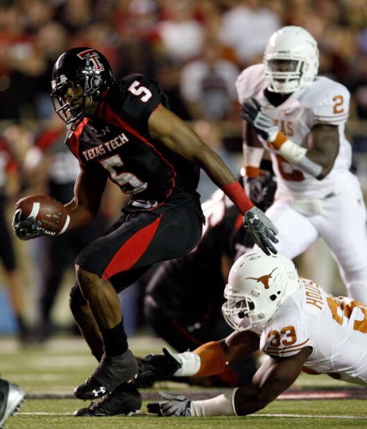 LUBBOCK, TX - NOVEMBER 01: Michael Crabtree #5 of the Texas Tech Red Raiders carries the ball after making a reception during the first half of the game against the Texas Longhorns on November 1, 2008 at Jones Stadium in Lubbock, Texas. (Photo by Jamie