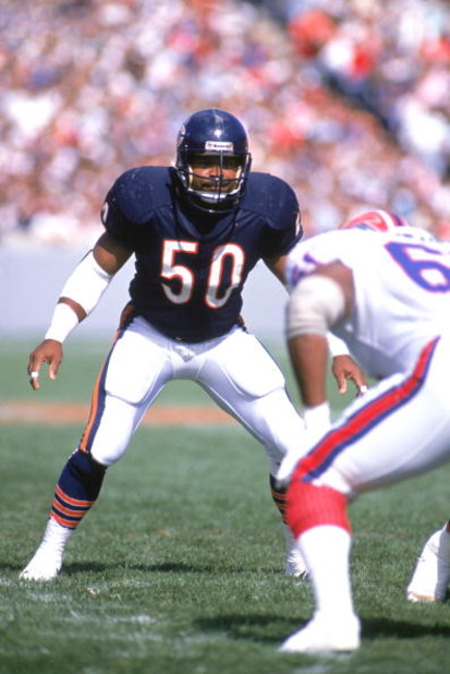 CHICAGO - OCTOBER 2:  Linebacker Mike Singletary #50 of the Chicago Bears prepares for a play as he stares down at the competition during a game against the Buffalo Bills at Soldier Field Stadium on October 2, 1988 in Chicago, Illinois.  The Bears won 24-