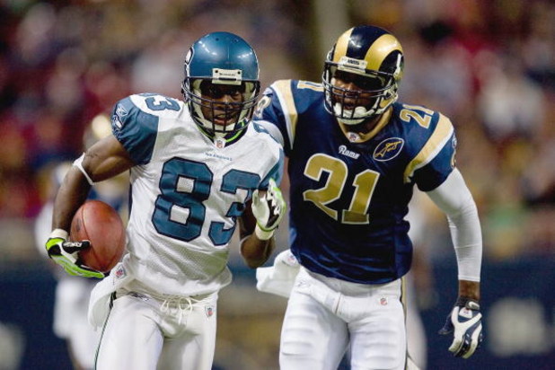 ST. LOUIS, MO - DECEMBER 14: Deion Branch #83 of the Seattle Seahawks carries the ball against Oshiomogho Atogwe #21 of the St. Louis Rams at the Edward Jones Dome on December 14, 2008 in St. Louis, Missouri. (Photo by: Dilip Vishwanat/Getty Images)