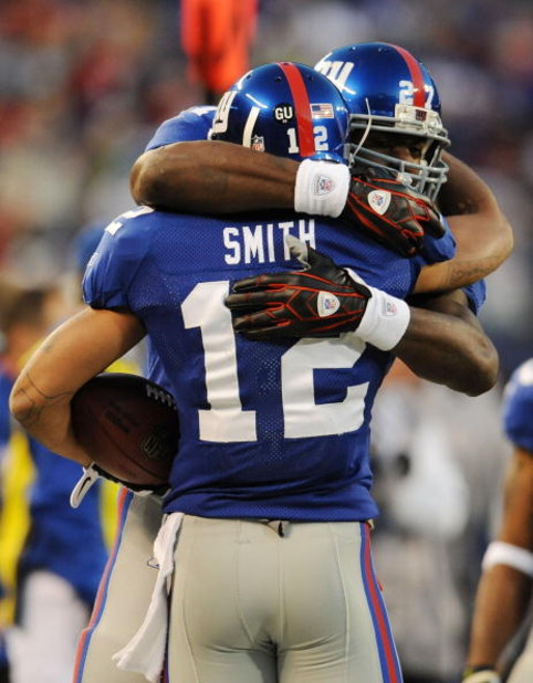 EAST RUTHERFORD, NJ - NOVEMBER 02: Steve Smith #12 of the New York Giants meets Brandon Jacobs #27 after scoring a touchdown against the Dallas Cowboys during their game on November 2, 2008 at Giants Stadium in East Rutherford, New Jersey. (Photo by Al
