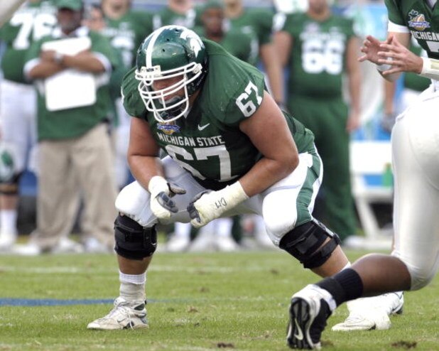 ORLANDO, FL - JANUARY 1: Guard Joel Foreman #67 of the Michigan State Spartans sets to block against the Georgia Bulldogs at the 2009 Capital One Bowl at the Citrus Bowl on January 1, 2009 in Orlando, Florida. (Photo by Al Messerschmidt/Getty Images)