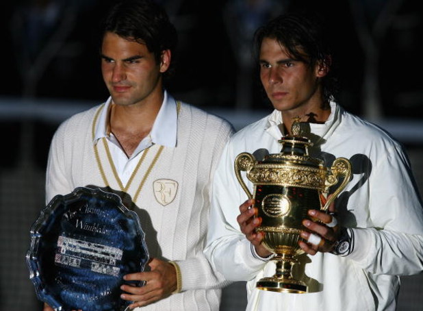 LONDON - JULY 06: Rafael Nadal of Spain and Roger Federer of Switzerland pose for pictures with after Nadal won in five sets in the final on day thirteen of the Wimbledon Lawn Tennis Championships at the All England Lawn Tennis and Croquet Club on July 6