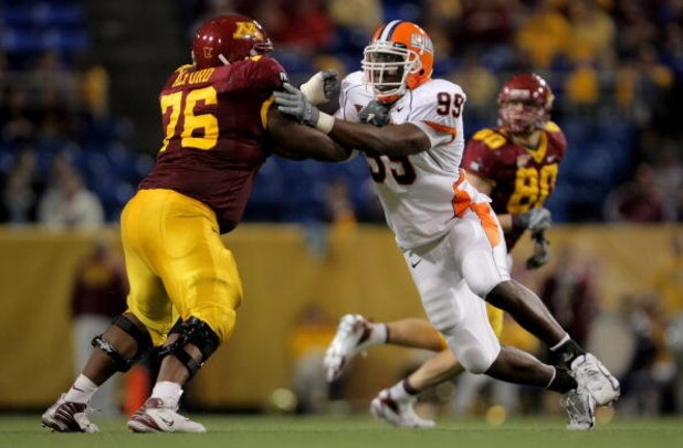 MINNEAPOLIS, MN - NOVEMBER 03: Guard Dominic Alford #76 of the Minnesota Golden Gophers blocks defensive end Jerry Brown #99 of the Illinois Fighting Illini at the Hubert H. Humphrey Metrodome on November 3, 2007 in Minneapolis, Minnesota. Illinois defea