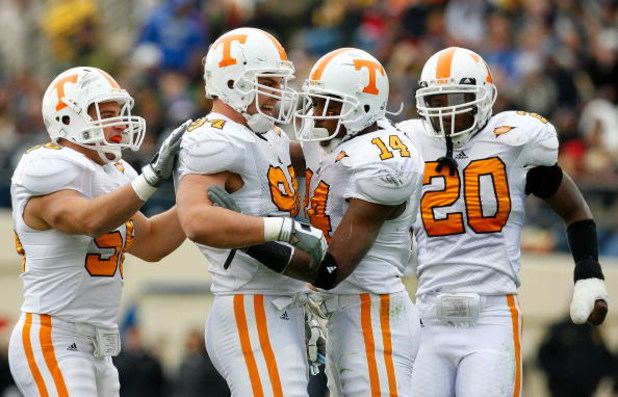 NASHVILLE, TN - NOVEMBER 22:  Nick Reveiz #56, Wes Brown #94, Eric Berry #14 and Nevin McKenzie #20 of the Tennessee Volunteers react after a defensive stop against the Vanderbilt Commodores during the game at Vanderbilt Stadium on November 22, 2008 in Na