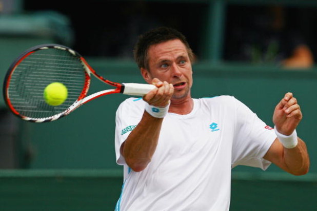WIMBLEDON, ENGLAND - JUNE 29: Robin Soderling of Sweden plays a forehand during the men's singles fourth round match against Roger Federer of Switzerland on Day Seven of the Wimbledon Lawn Tennis Championships at the All England Lawn Tennis and Croquet C