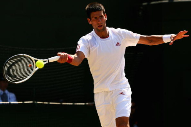 WIMBLEDON, ENGLAND - JULY 01: Novak Djokovic of Serbia plays forehand during the men's singles quarter final match against Tommy Haas of Germany on Day Nine of the Wimbledon Lawn Tennis Championships at the All England Lawn Tennis and Croquet Club on Jul