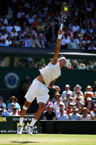 WIMBLEDON, ENGLAND - JUNE 25: Juan Martin Del Potro of Argentina serves during the men's singles second round match against Lleyton Hewitt of Australia on Day Four of the Wimbledon Lawn Tennis Championships at the All England Lawn Tennis and Croquet Club