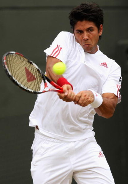 WIMBLEDON, ENGLAND - JUNE 29:  Fernando Verdasco of Spain plays a backhand during the men's singles fourth round match against Ivo Karlovic of Croatia on Day Seven of the Wimbledon Lawn Tennis Championships at the All England Lawn Tennis and Croquet Club 