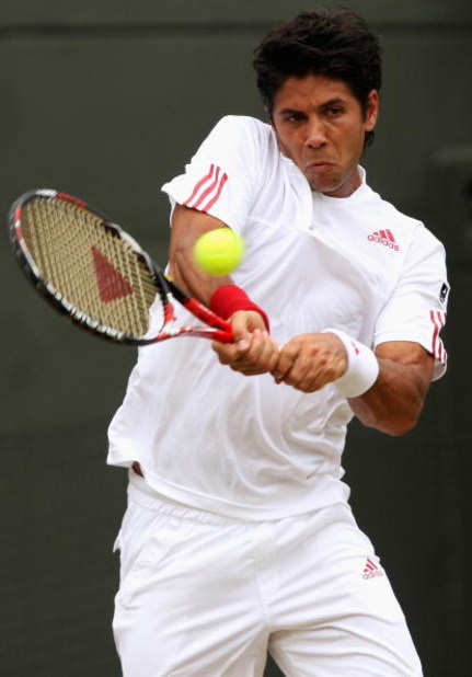 WIMBLEDON, ENGLAND - JUNE 29: Fernando Verdasco of Spain plays a backhand during the men's singles fourth round match against Ivo Karlovic of Croatia on Day Seven of the Wimbledon Lawn Tennis Championships at the All England Lawn Tennis and Croquet Club