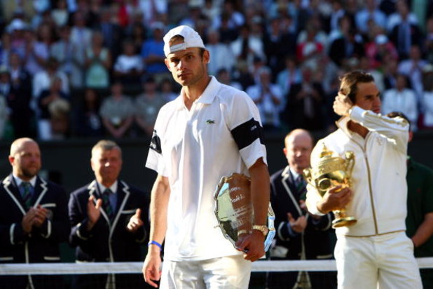 WIMBLEDON, ENGLAND - JULY 05: Andy Roddick of USA looks despondent after defeat during the men's singles final match against Roger Federer of Switzerland on Day Thirteen of the Wimbledon Lawn Tennis Championships at the All England Lawn Tennis and Croque