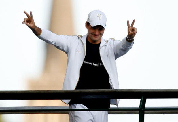 WIMBLEDON, ENGLAND - JULY 05: Roger Federer of Switzerland salutes spectators after victory in the men's singles final match against Andy Roddick of USA on Day Thirteen of the Wimbledon Lawn Tennis Championships at the All England Lawn Tennis and Croquet